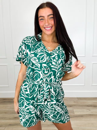 Green leaf-print rayon-blend romper with short sleeves and gathered waist, front view