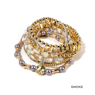 Smoke beaded bracelet stack with gold-tone beads, pearl-like accents, and rhinestone strands