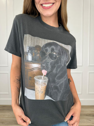 Grey short-sleeve graphic tee with black dog wearing sunglasses beside an iced drink