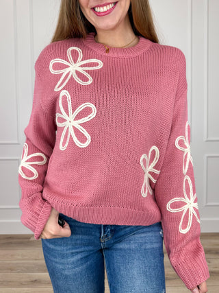 Pink long-sleeve knit sweater with white bow embroidery, crew neck ribbed cuffs