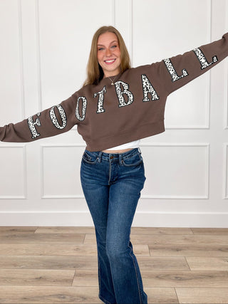 Brown cropped graphic crewneck sweatshirt with football-style letter print and long sleeves