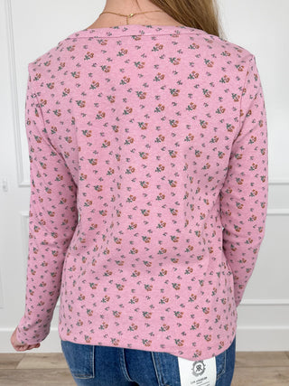 Pink long-sleeve floral print top, back view with button placket and yoke