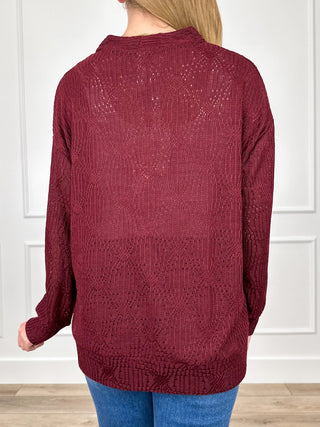Wine red knit long-sleeve cardigan back view with button placket detail