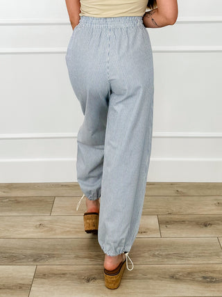 High-rise pinstripe cotton joggers with drawstring waist and gathered ankle cuffs