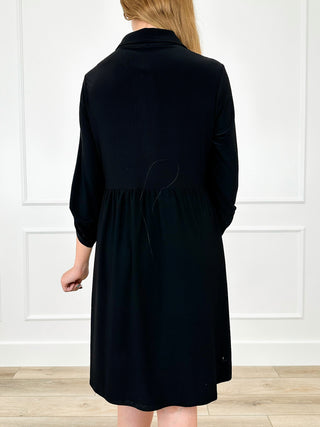 Dear Scarlett winkle-free dress, black back view with gathered skirt and 3/4 sleeves
