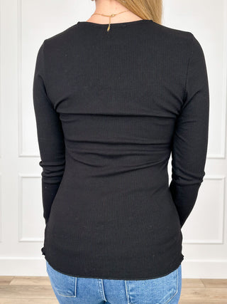 Black ribbed long-sleeve top, back view