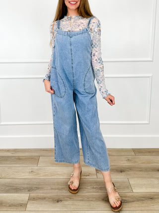 Light wash denim cotton jumpsuit with wide legs and long printed sleeves
