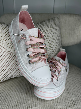 White canvas lace-up sneakers with colorful beaded laces and low platform sole