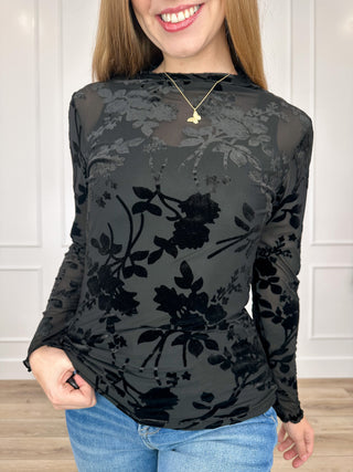 Sheer long-sleeve black top with dark floral print and high neckline