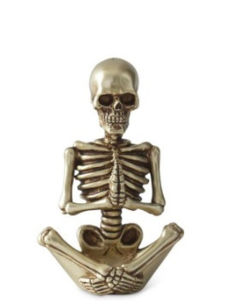 Gold resin skeleton decor variants with skull head and ribcage.