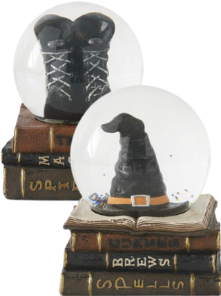 Snow globe set with witch hat and boots on spell books, two clear domes