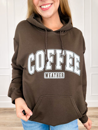 Brown hoodie sweatshirt with 'COFFEE WEATHER' chest graphic and hood