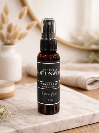 Hand sanitizer spray bottle, Winterfell scent, 2 oz, clear pump and dark glass