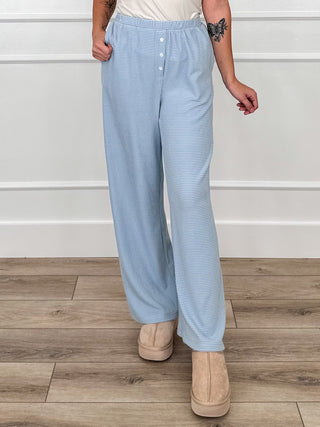 Light blue high-rise striped pants with button front and side pockets