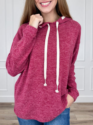 Wine red heather knit long-sleeve hooded top with white drawstring ties.