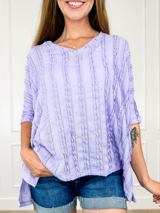 Lightweight short-sleeve knit top in periwinkle lavender with vertical cable pattern