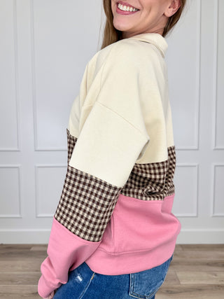 Long-sleeve quarter-zip top, cream shoulder and sleeves with gingham yoke and pink front