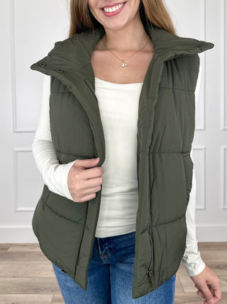 Olive green puffer vest with hood, zip front, quilted panels and side pockets