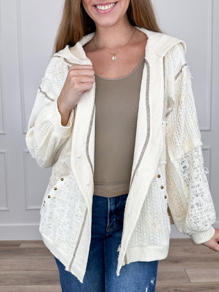 Cream hooded lightweight shacket with open front, snap buttons, and patch pockets