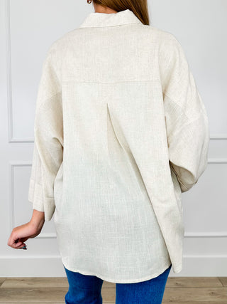 Sand knit 3/4 sleeve button-up top, back view with yoke seam and relaxed drape
