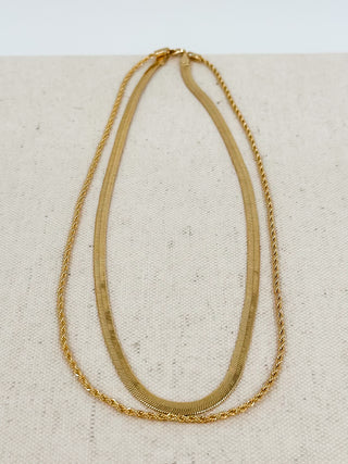 Gold double-chain necklace with teardrop drape
