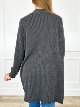 Ribbed long sleeve cardigan in dark charcoal, open back view with side pockets