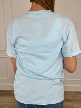 Light blue short-sleeve cotton graphic tee, back view