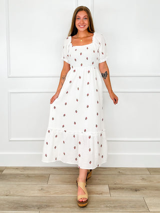 White maxi cotton-blend dress with puff sleeves, square neckline, red floral print.