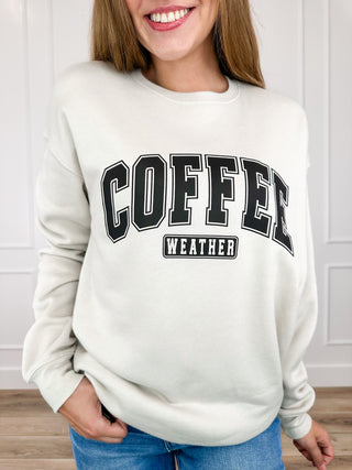 Oat crewneck sweatshirt with 'COFFEE WEATHER' graphic across the chest, long sleeves