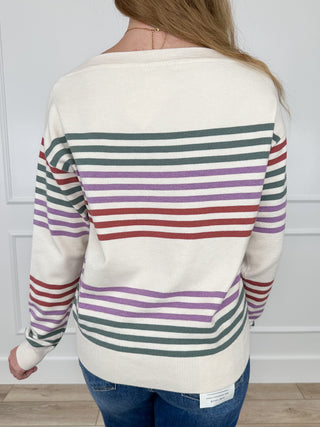 Ivory knit long-sleeve sweater with multicolor horizontal stripes, back view