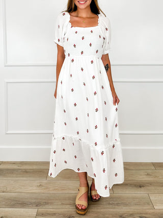 White maxi cotton-blend dress with puff sleeves, red floral print, tiered skirt hem.