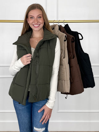 Olive green sleeveless puffer vest with hood and zip-front, side pockets