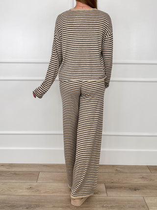 Sand-and-black striped knit set, back view: long-sleeve top and high-rise wide-leg pants.