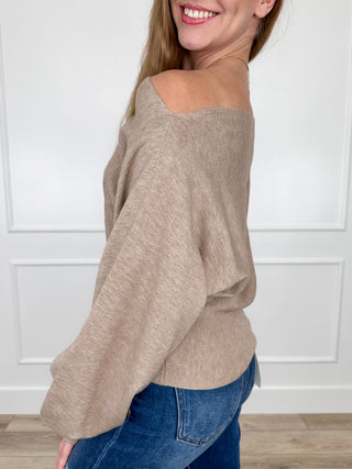 Taupe off-shoulder knit sweater top with long sleeves, relaxed drape