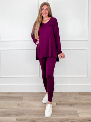 High-rise cropped leggings set in deep purple, long-sleeve tunic top and fitted leggings