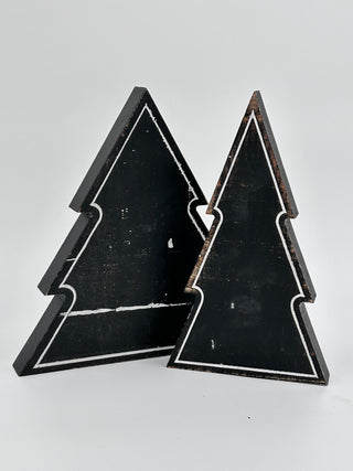 Set of two black wooden tree decorations with contrasting outlined edges