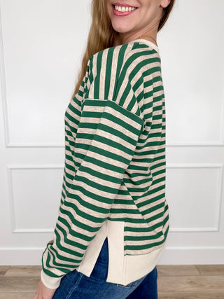 Green and white striped long sleeve top with V-neck and contrast hem band