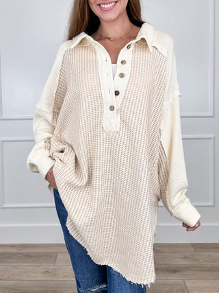 Cream long-sleeve henley tunic top with button placket and textured knit