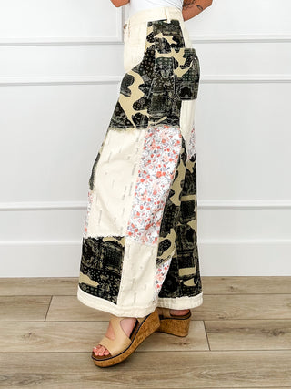 High-rise wide-leg cotton pants, cream patchwork with black camo and floral side panels
