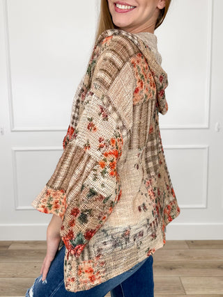 Women's hooded button-up top, brown textured fabric with scattered red floral print