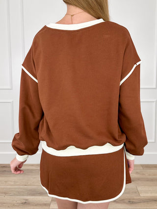 Brown long-sleeve top and drawstring shorts set with white trim, back view