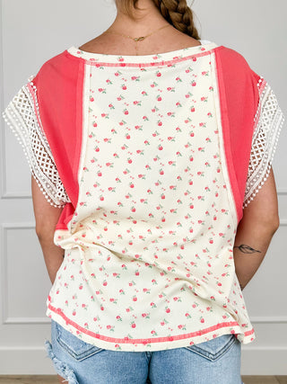 Cream short sleeve top back with red yoke, small floral pattern, lace-trim sleeves