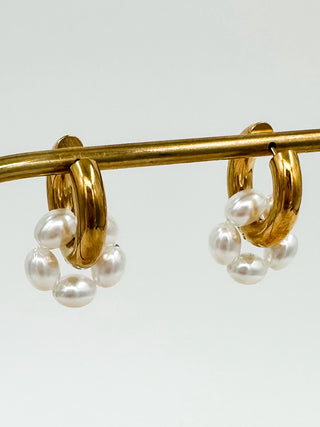 Gold drop earrings with clustered white pearls and gold hoops