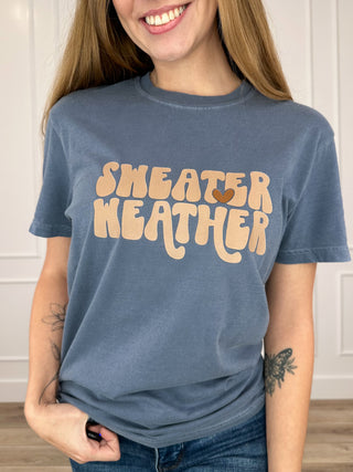 Women’s blue cotton short-sleeve crew tee with “Sweater Weather” graphic front