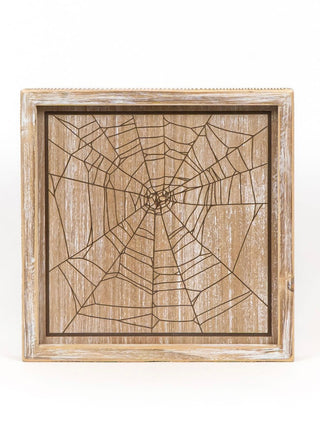 Reversible wood shelf sitter with spider web line pattern in light wood frame