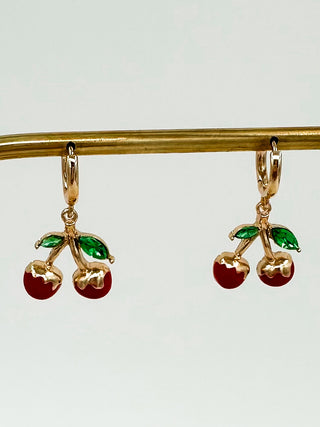 Gold drop earrings with cherry charms, red fruit and green leaves