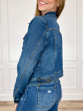 Dark wash cropped denim jacket, long sleeves, button front, flap chest and side pockets