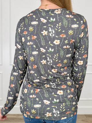 Women's long-sleeve V-neck top, floral leaf print; back view, dark grey