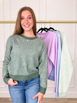 Dark green knit long-sleeve sweater top with crew neckline, front view