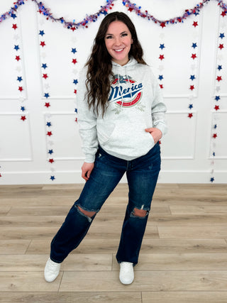 Two-piece outfit: light gray hooded sweatshirt with logo, blue distressed jeans